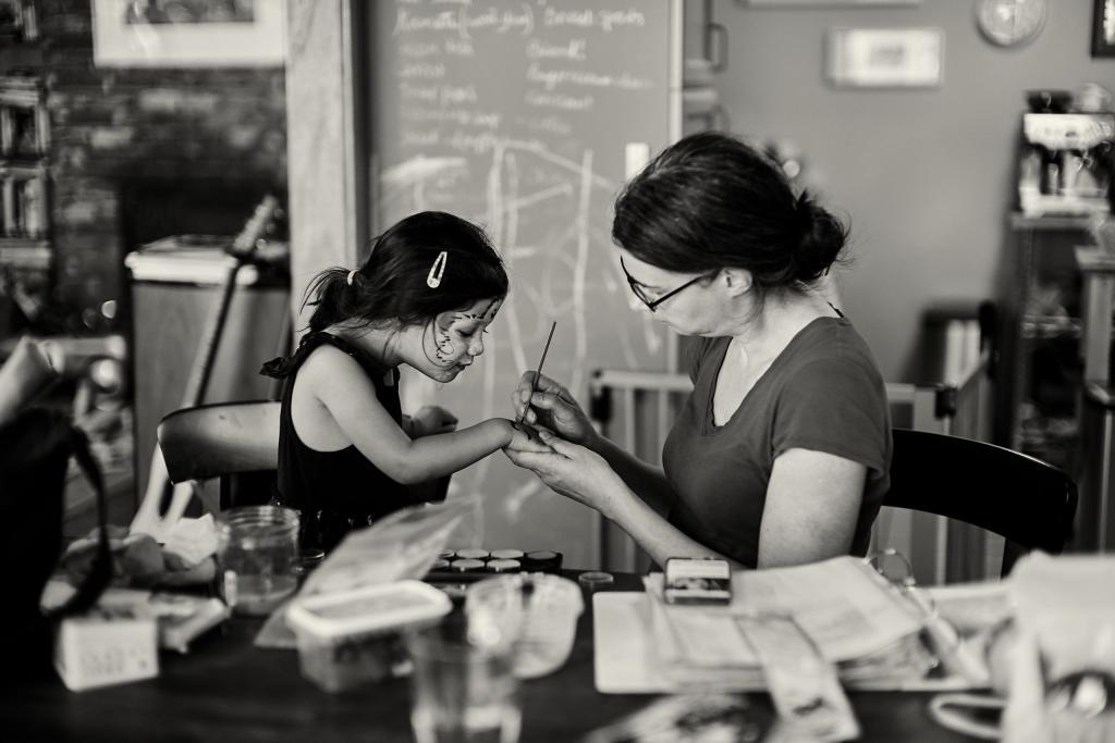 Painting Together Jen painting her daughter's hand.