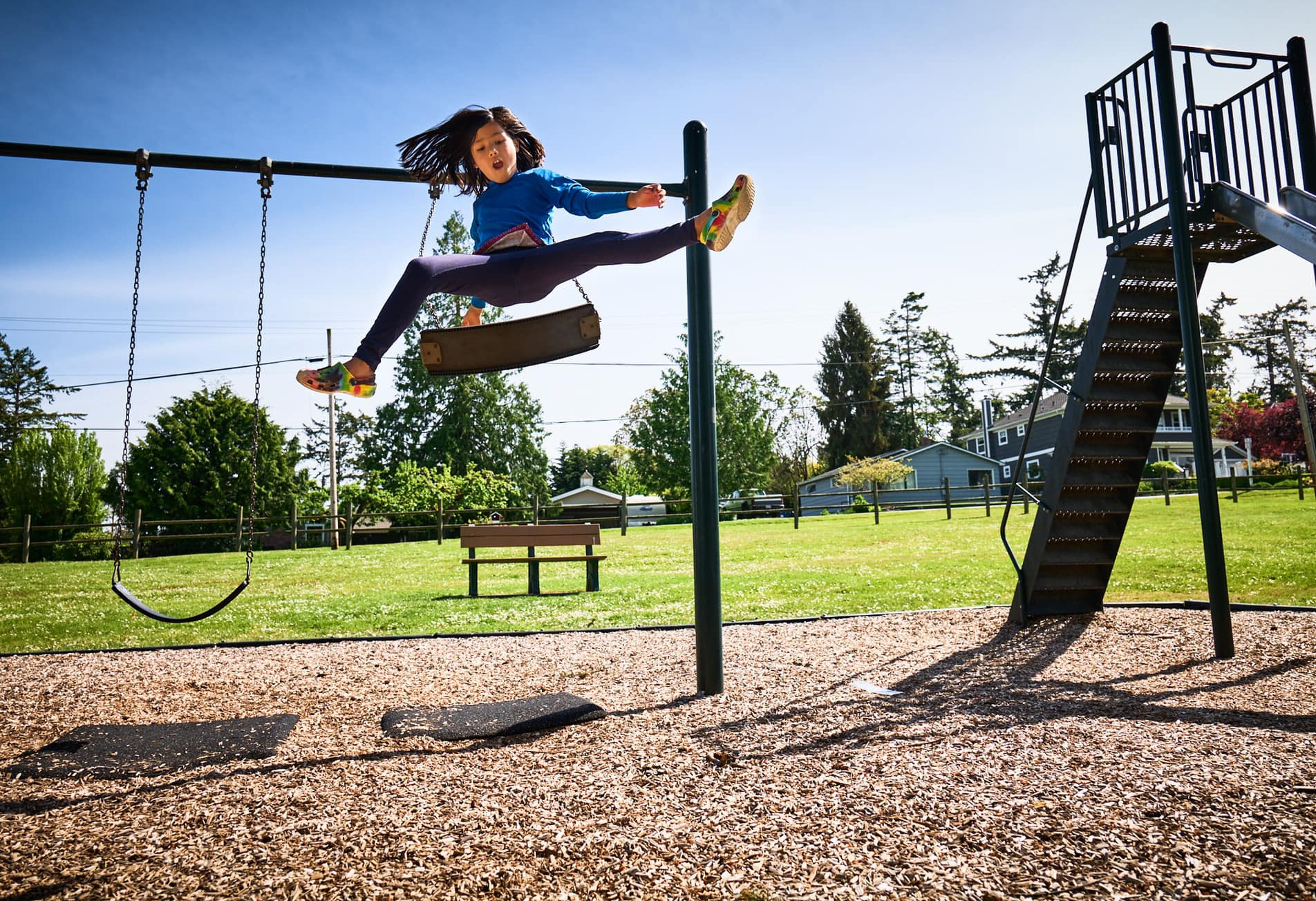 Child jumping off swing. Your Parenting Mojo podcast episodes